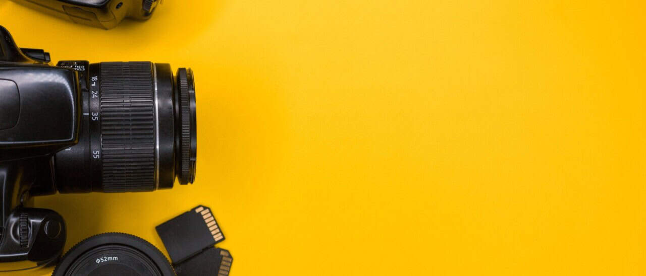 Camera equipment against a yellow background