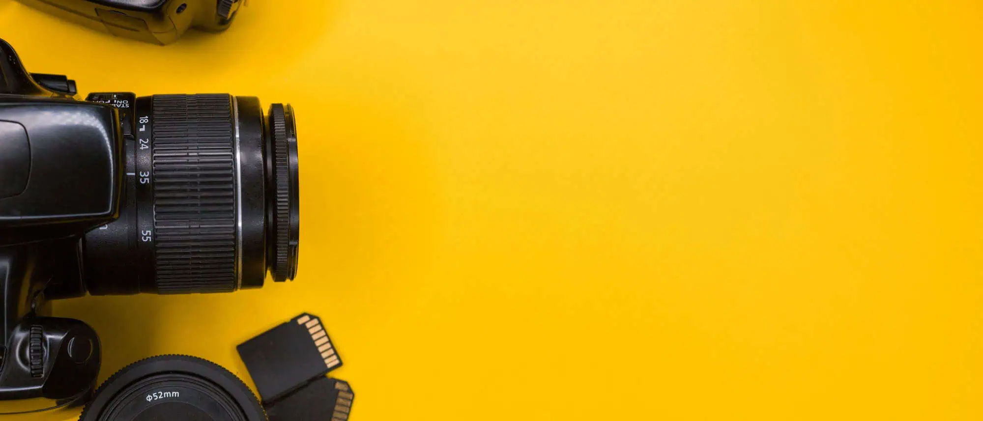 Camera equipment against a yellow background