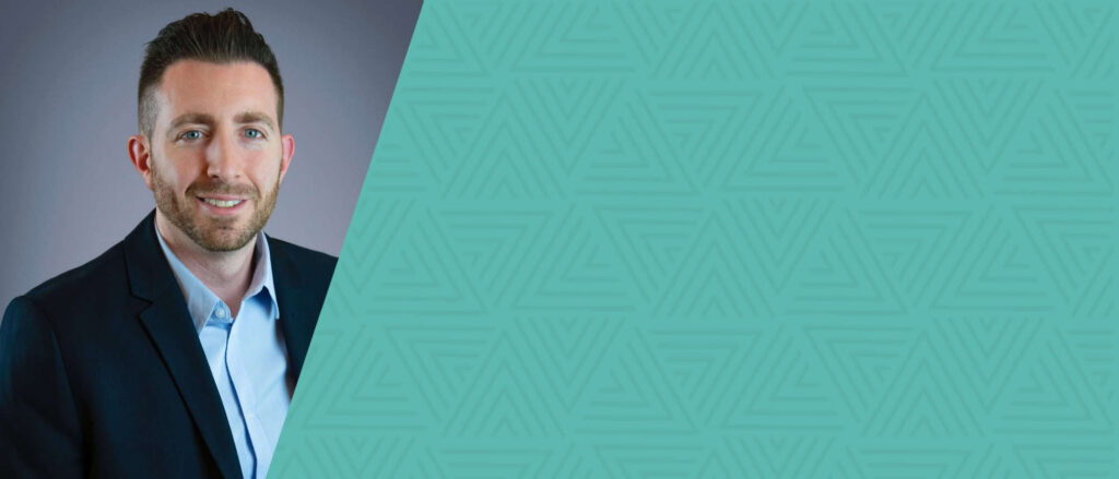 Headshot of Marc Sausa against a blue background