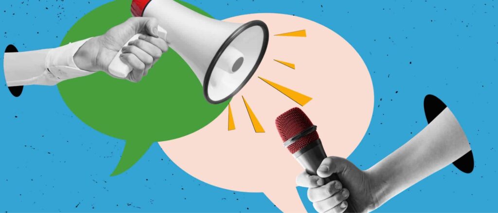 Stock image of a megaphone and microphone against a blue background