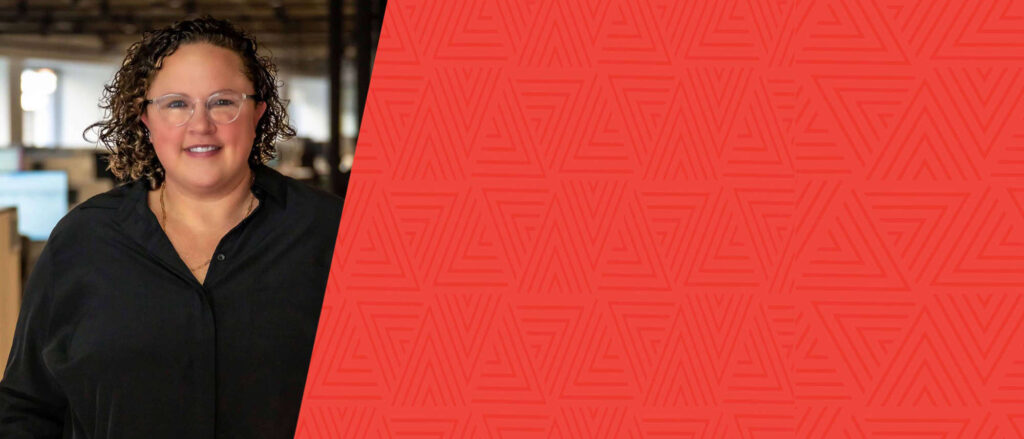 Headshot of Megan Hueter with red background