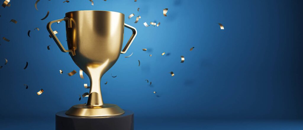 Stock image of a trophy against a blue background
